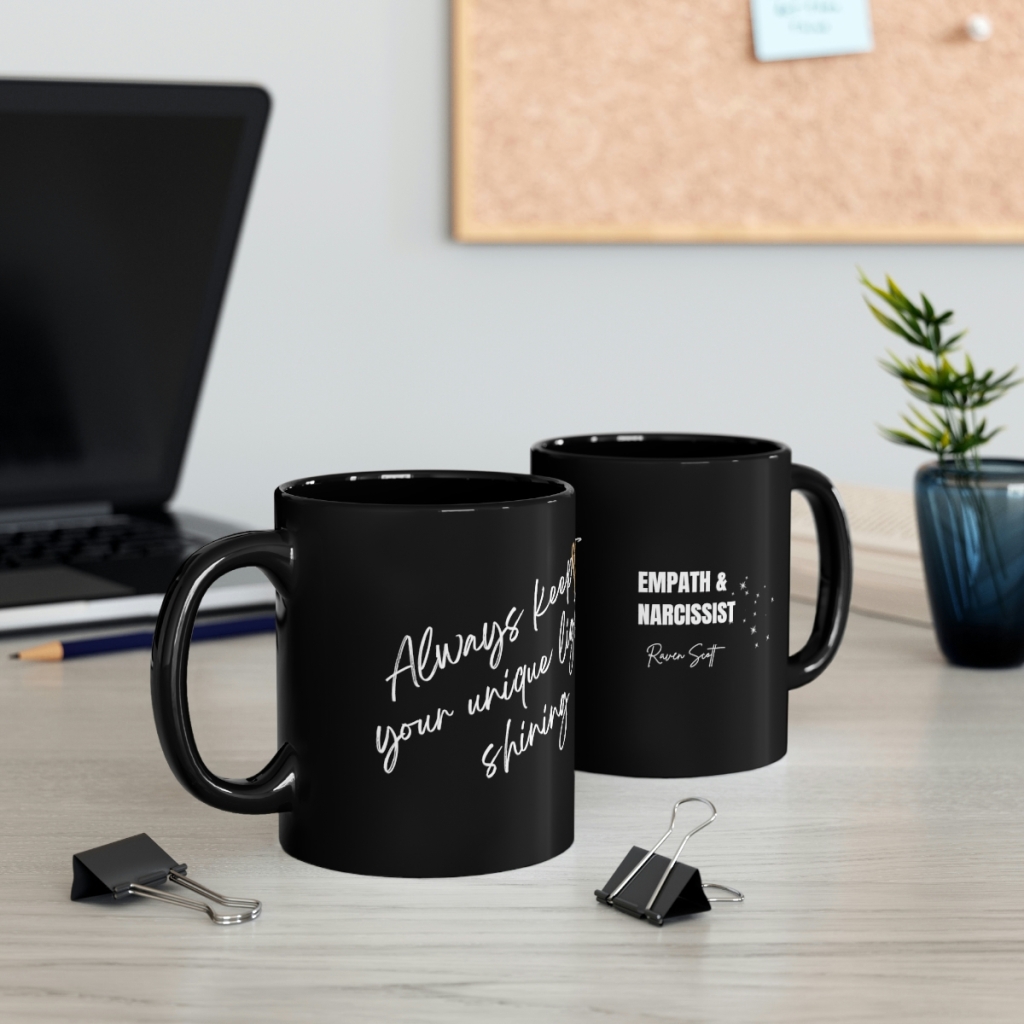 two black coffee mugs with white writing on it " Empath and the Narcisst" cursive quote writing on other